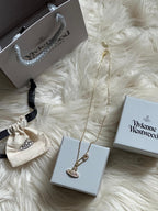 Vivienne Westwood Safety Pin Orb Necklace – Gold-Tone Crystal Pendant with Gift Box & Pouch